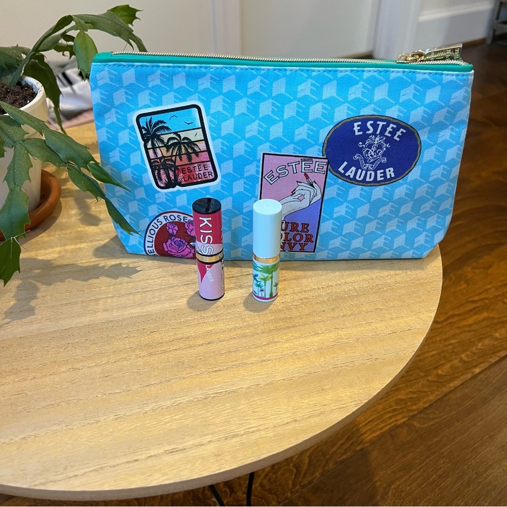 Two Estee Lauder‎ full size lipsticks/cosmetic bag